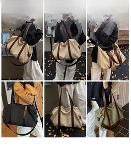 Detailed views of the large canvas tote bag with leather handles and long shoulder straps