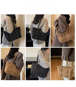 Detail of vintage large capacity tote bag with side pockets and metal ring adjustable straps