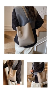 Detail of beige litchi grain tote bag with inner pouch shown in a street lifestyle setting