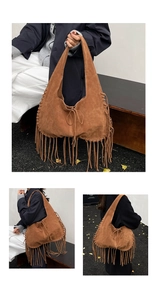 Close-up of handmade fringe details and thick stitching on brown suede hobo bag