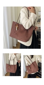 Detail of dark brown matte tote bag featuring a retro wooden beaded tassel decoration