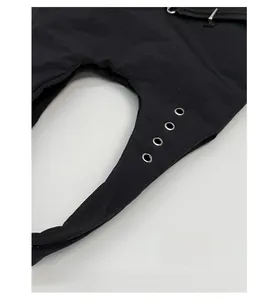 Detail of durable scratch-resistant black fabric with metal eyelets and adjustable strap