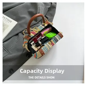 Top view of rainbow woven bag interior showing lipstick and cushion for capacity