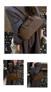 Detail of vintage brown leather bowling bag with fine stitching and long double handles