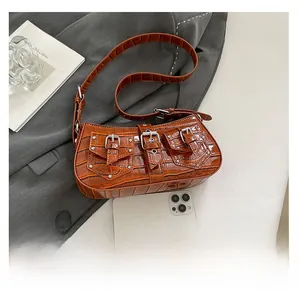 Caramel brown crocodile embossed baguette bag with silver buckles and smartphone size reference