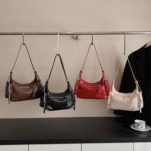 Retro motorcycle shoulder bags shown in brown, black, red and beige leather textures