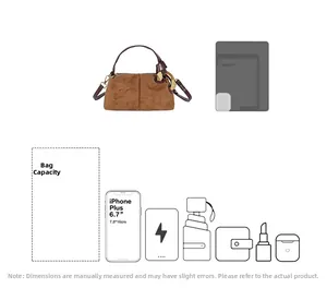 Spacious interior of brown suede Boston bag showing phone, umbrella, and daily essentials