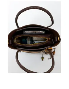 Top view of the bucket bag interior showing spacious main compartment and zipper pocket