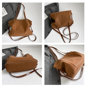 Detail view of large brown leopard print tote bag with adjustable shoulder straps