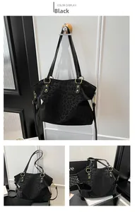 Detail of black leopard print tote bag with gold ring hardware and rivet accents