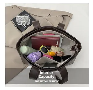 Macro view of the large capacity interior with zip pocket for tablets and daily items