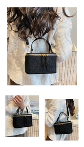 Macro detail of black woven leather mini box bag featuring premium gold-tone hardware