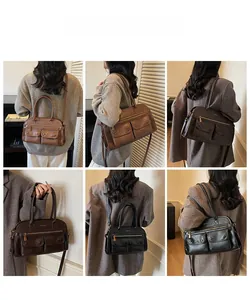 Macro view of multi-pocket retro faux leather tote bag showing matte texture and hardware