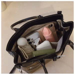 Top view of large canvas tote bag showing spacious interior with multiple storage compartments