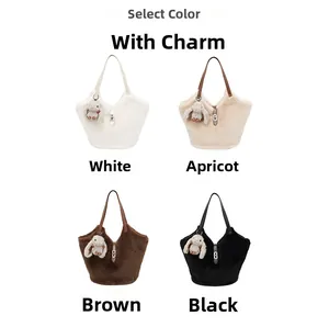 Detail of four plush tote bags with cute bunny pendants in white apricot brown and black