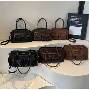 Three vintage multi-pocket shoulder bags in black, dark brown and tan on white podiums