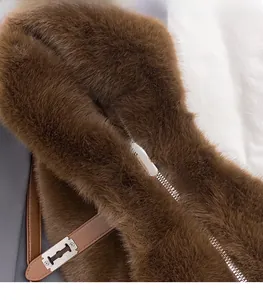 Detailed macro view of plush coffee brown faux fur texture and silver metal zipper