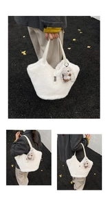 Detail of white plush tote bag with leather straps and a cute brown bunny charm