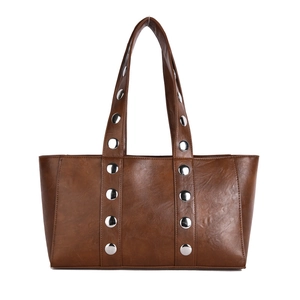Brown faux leather tote bag with silver metal studs and minimalist buckle straps