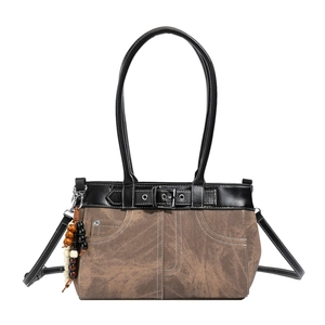 Retro canvas tote bag with black leather trim and bead pendant on white background