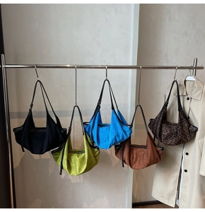 Selection of matte underarm bags in various colors including leopard print and solid tones