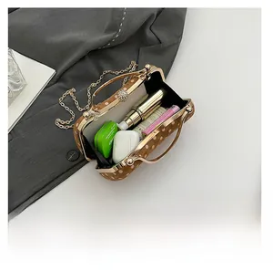 Detailed view showing the spacious interior of a retro polka dot crossbody box bag