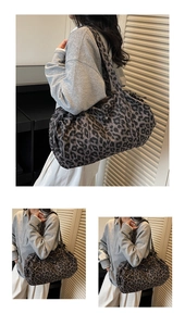 Detail view of large leopard print tote bag with wide strap and spacious interior