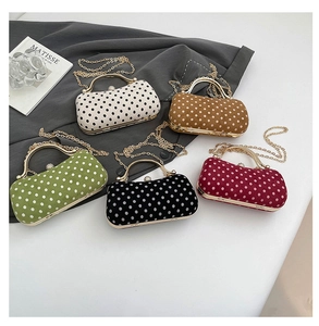 Polka dot evening bags in five colors with metal handles and detachable chain straps