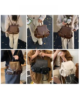 Detail view of stylish pleated drawstring backpacks in brown, black, and cream white colors