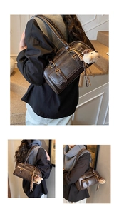 Detailed views of a dark brown retro bowling bag featuring leather straps and metal buckles