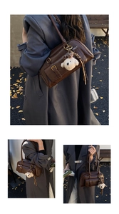 Detail of dark brown retro bowling bag with small front pocket and bear charm