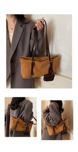 Close-up of brown suede hobo bag with adjustable strap and matching mini pouch detail