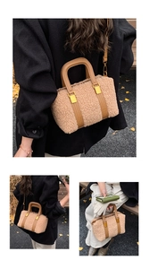 Close-up of faux lamb wool bag showing brown leather straps and gold metal buckles