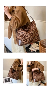 Leopard print hobo bag with brown leather base and reinforced stitching detail