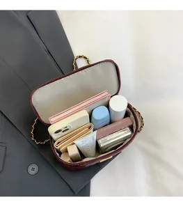Interior view of wine red quilted bag showing spacious storage for daily essentials