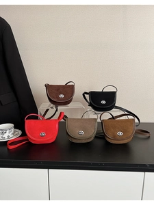 Detailed view of mini saddle bags in five colors on a display stand with accessories