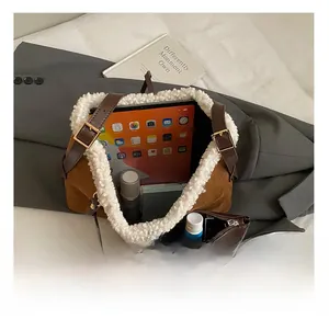 Interior view of brown suede bucket bag with white fleece trim showing large capacity