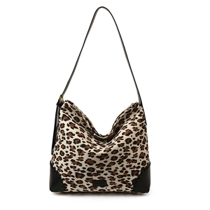 Retro leopard print shoulder bag with black suede stitching and adjustable strap