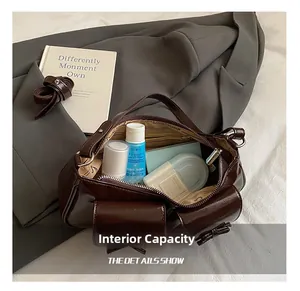 Macro detail of spacious interior with branding lining in dark brown glossy handbag