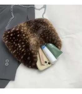 Detailed view of the leopard print faux fur bucket bag showing spacious interior capacity