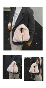 Detail of pink faux fur crossbody bag featuring golden ball charm and silver metal chain