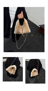 Detail of faux fur plush bag with leopard print, chain strap and gold sphere closure