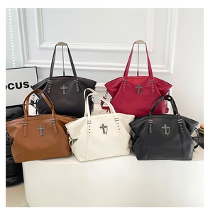 Gothic tote bag collection featuring five colors with cross pendant and star rivet details