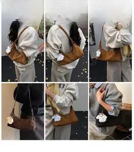 Detailed views of vintage hobo bag with adjustable strap and cute plush puppy charm