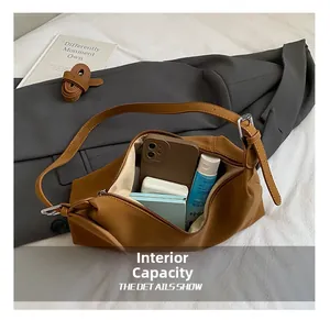 Internal capacity of the caramel brown crossbody bag showing spacious storage space