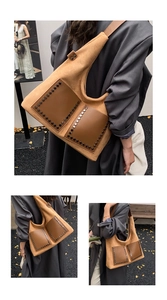 Detailansicht der Vintage-Nieten auf der Veloursleder-Tragetasche mit großen Taschen