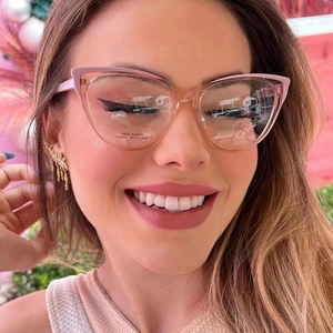 Detailed close-up of cat-eye acetate glasses frame featuring high-quality hinge texture
