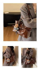 Detailed view of dark brown pleated leather tote bag with a cute bear charm pendant