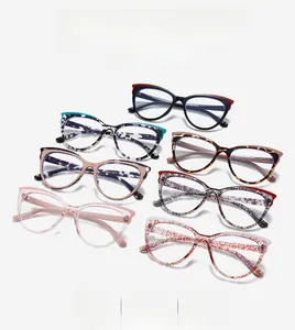 Flat lay of stylish cat-eye glasses frames in multiple colors and tortoiseshell patterns
