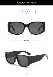 Front and side views of chunky black oversized sunglasses with dark grey lenses